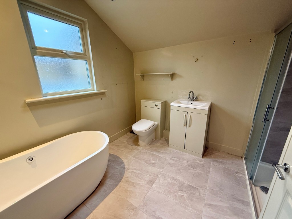 Lot: 10 - EXTENDED MID-TERRACE HOUSE IN TOWN CENTRE - Bathroom with shower and W.C.